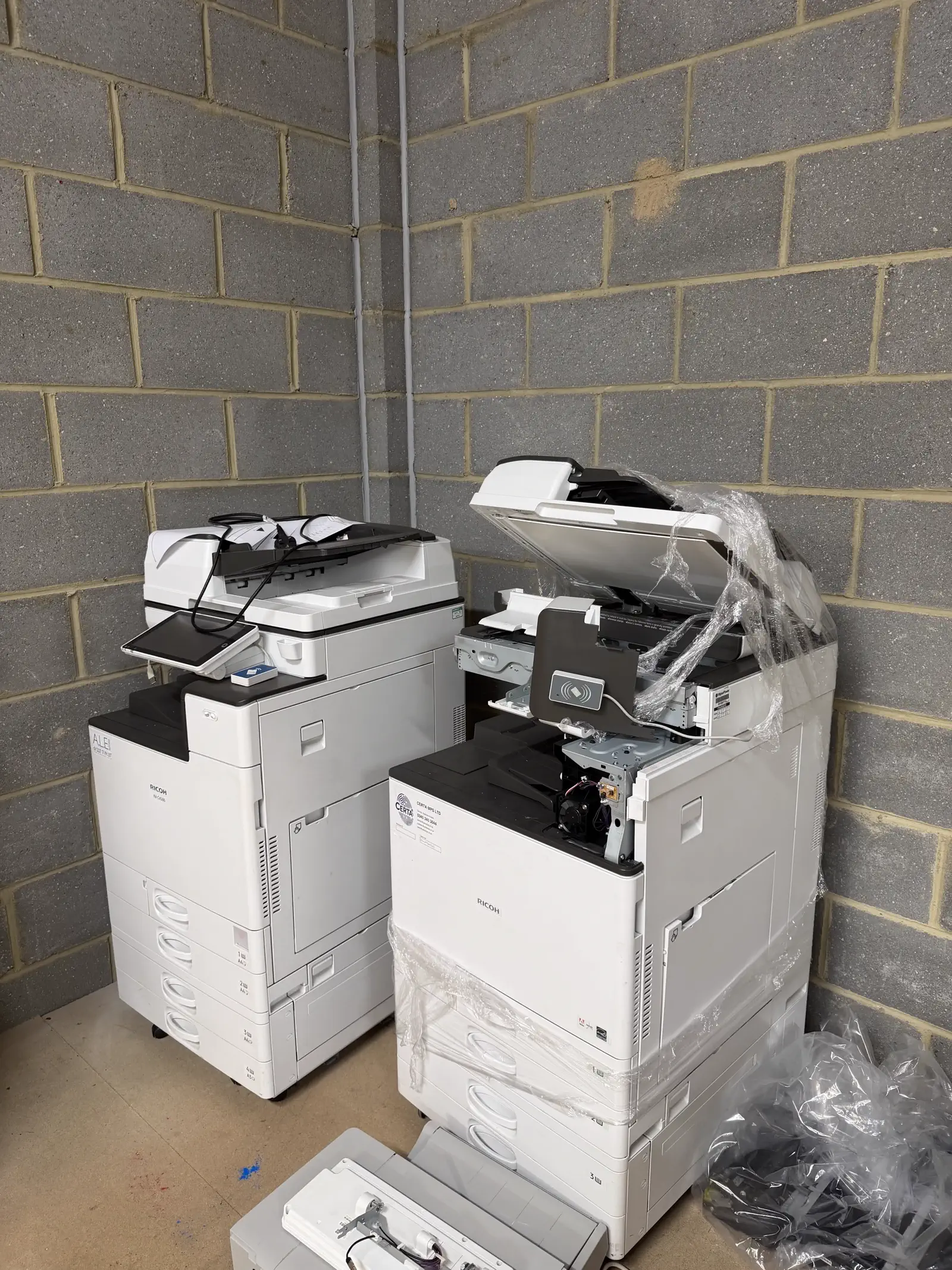 Multifunction printers part-dismantled for repair at Certa MPS