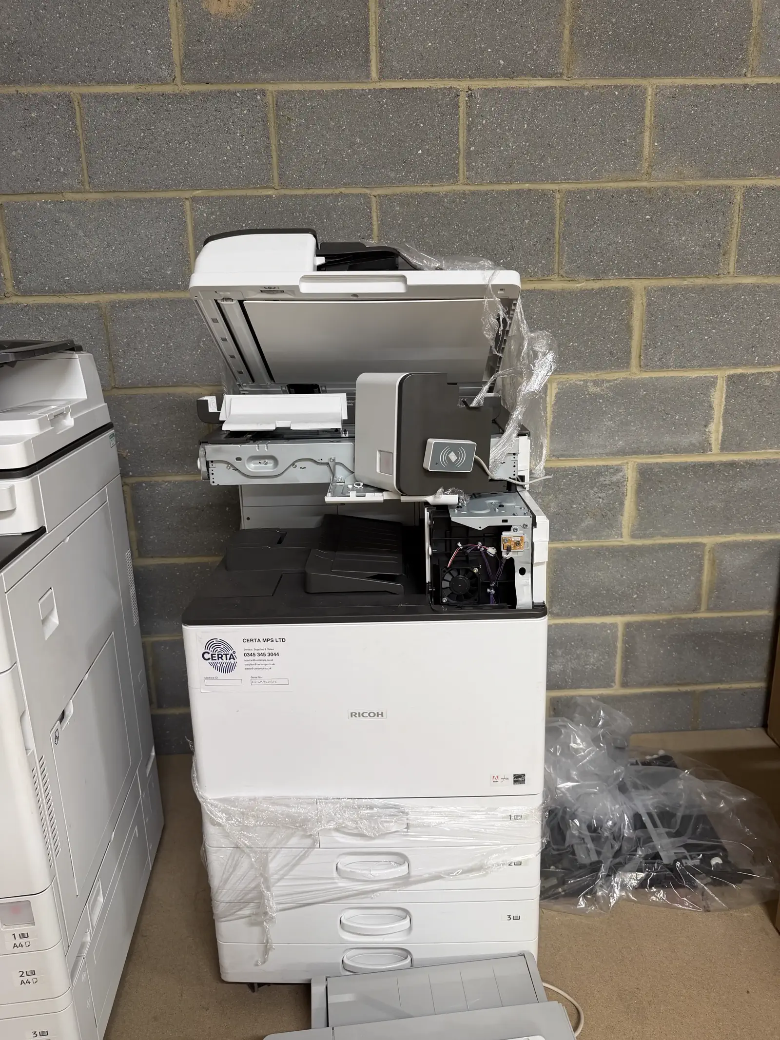 Multifunction printers part-dismantled for repair